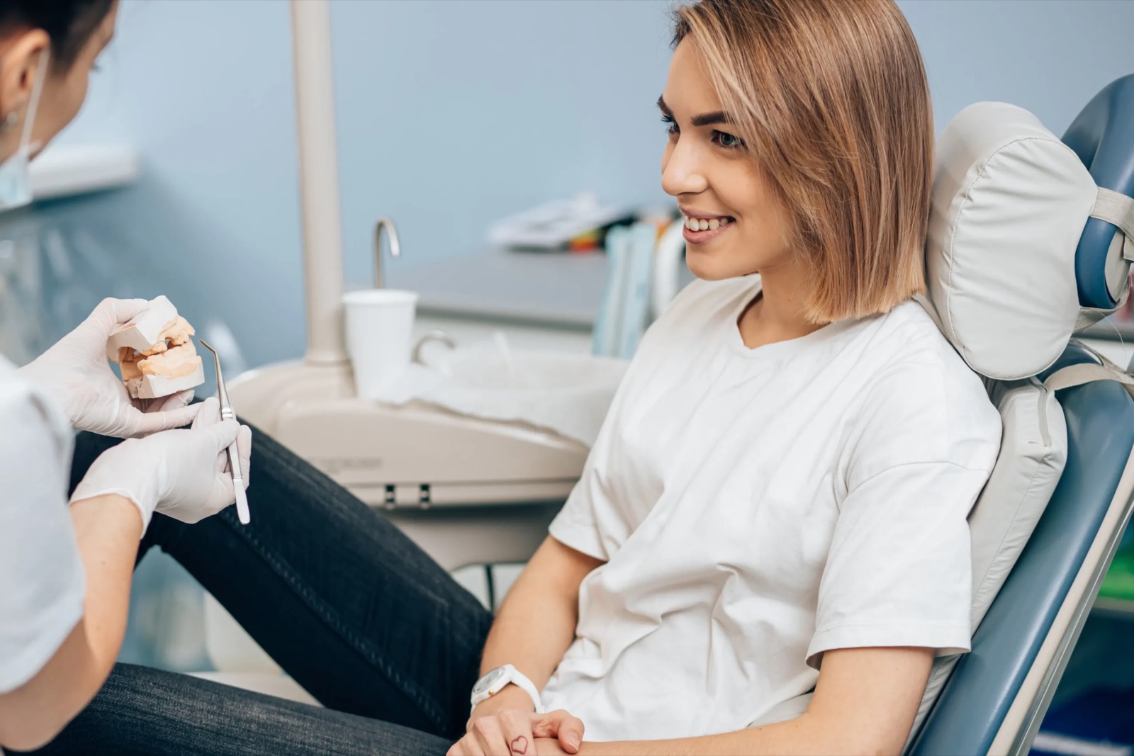 A patient seated in the treatment chair at Posh Dental Spa